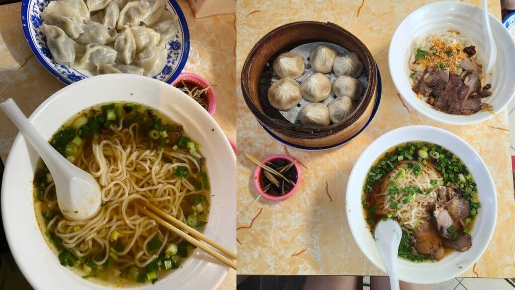 A large plate of fifteen freshly handmade steamed chive and pork dumplings served next to a bowl of savory mala noodles.