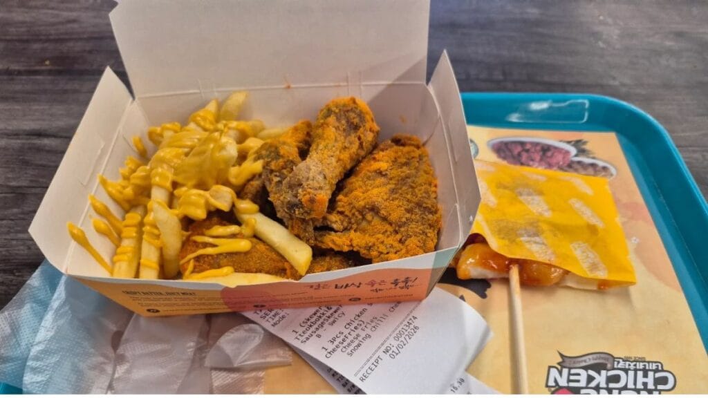 Best Bugis Halal Food 2026: 15 Must-Try Spots Near Bugis MRT 19 Nene Chicken: A platter of crispy Korean fried chicken glazed in savory and spicy sauces from Nene Chicken.