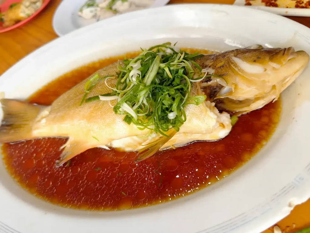 Jurong East Food: 20 Spots Worth The Queue 2 Glistening steamed red grouper with fermented bean soy sauce at Zai Shun, a popular Jurong East food court staple.