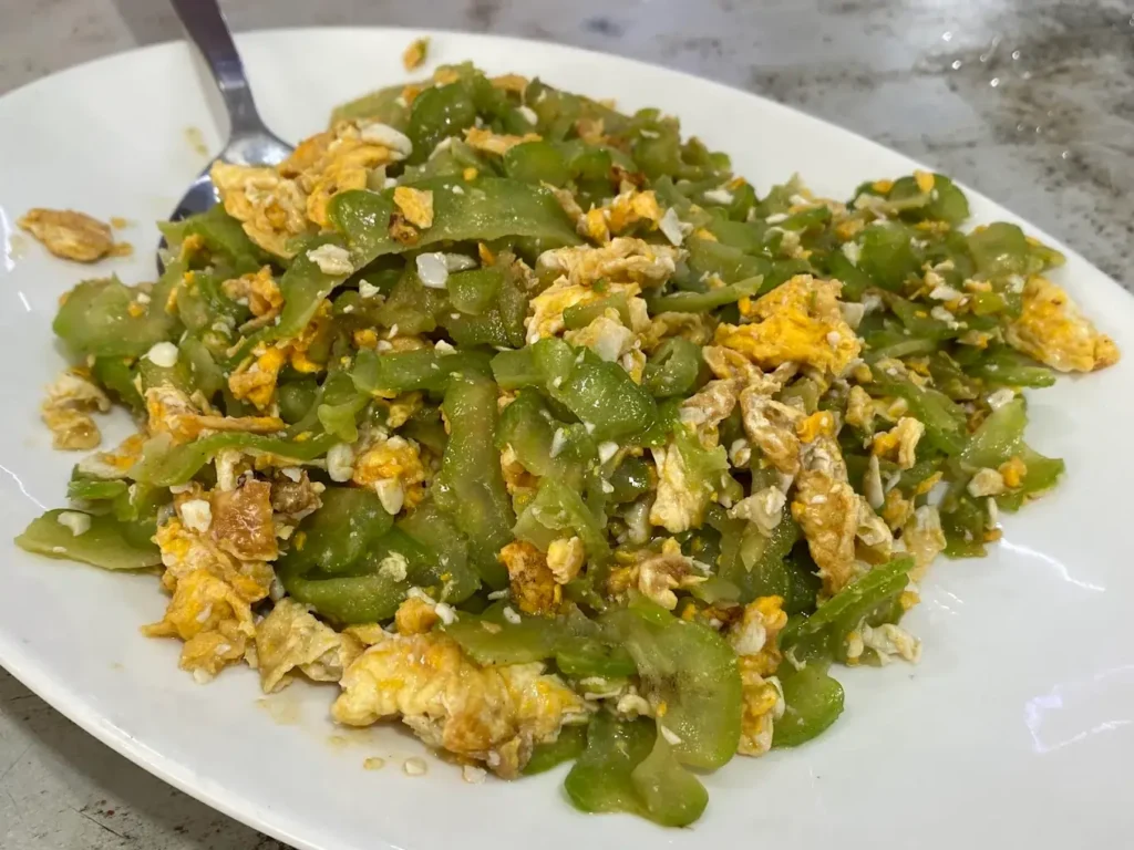 Jurong East Food: 20 Spots Worth The Queue 3 Rich bittergourd fried egg with salted egg yolk from a famous Teochew porridge Jurong East food stall.