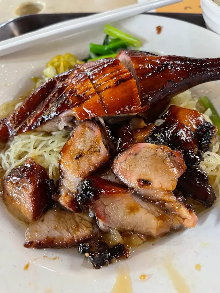 Jurong East Food: 20 Spots Worth The Queue 5 Slow-roasted charcoal duck noodles served with crispy pork lard croutons at Yuhua Village, a top Jurong East food option.
