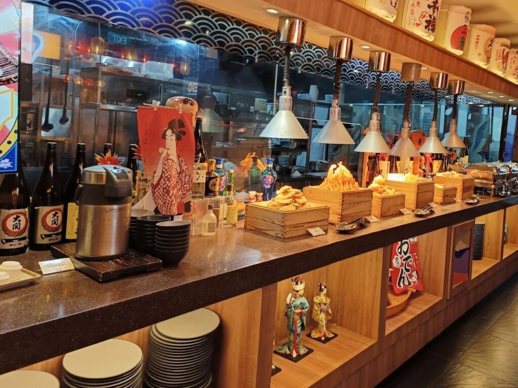 A vibrant display of over 200 Japanese dishes including fresh sashimi, tempura, and teppanyaki at KISEKI in Orchard Central.