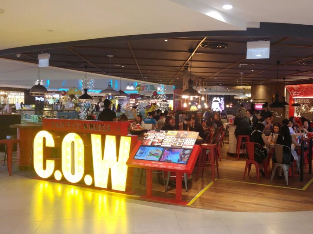 Cajun On Wheels Cajun seafood boil platter and casual seating Plaza Singapura Food