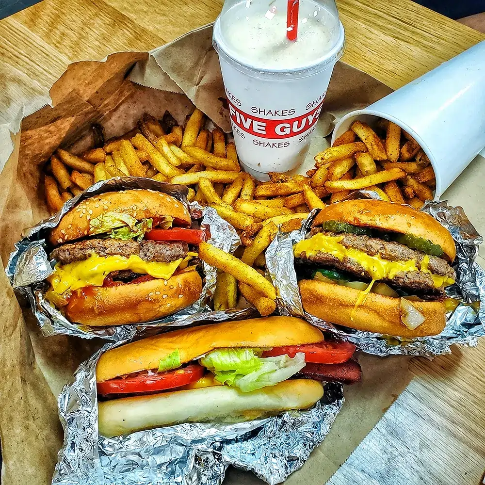 Freshly prepared burgers and Cajun fries served at Five Guys in Plaza Singapura.