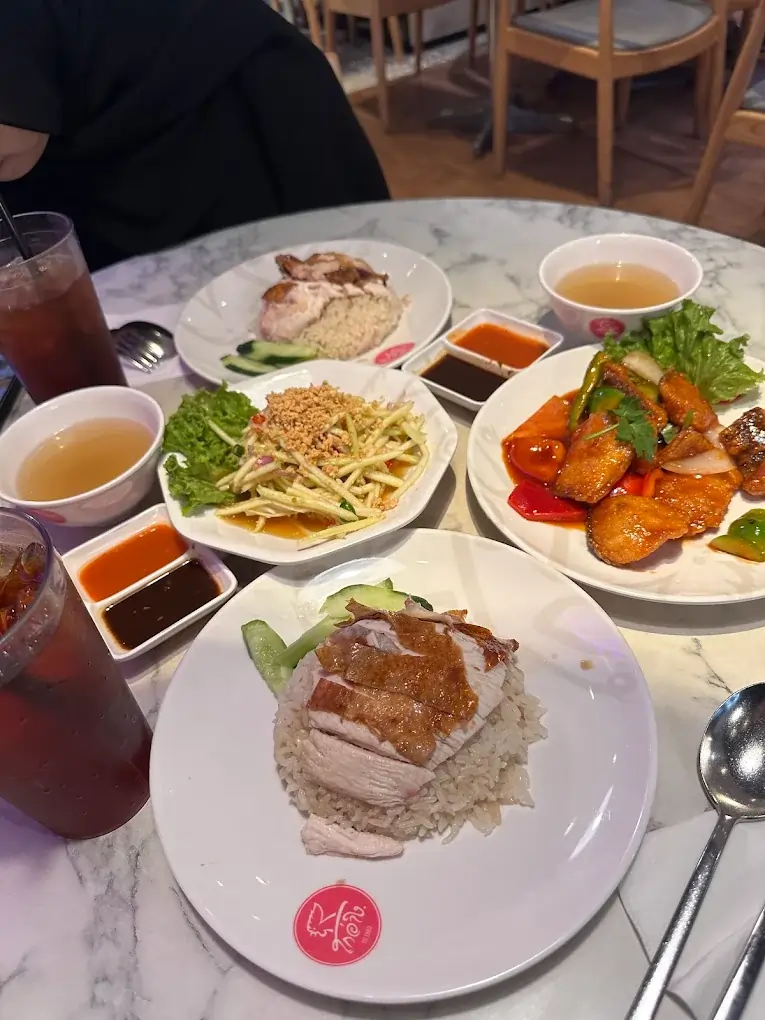 Tender poached chicken rice from Go-Ang Pratunam, a Michelin-style Plaza Singapura food outlet.