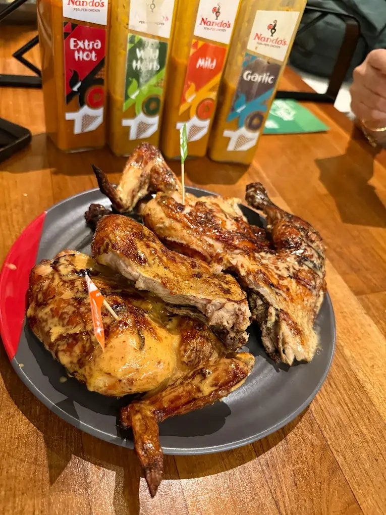 Spicy flame-grilled PERi-PERi chicken and veggies, a flavorful Tampines Mall food option at Nando's.