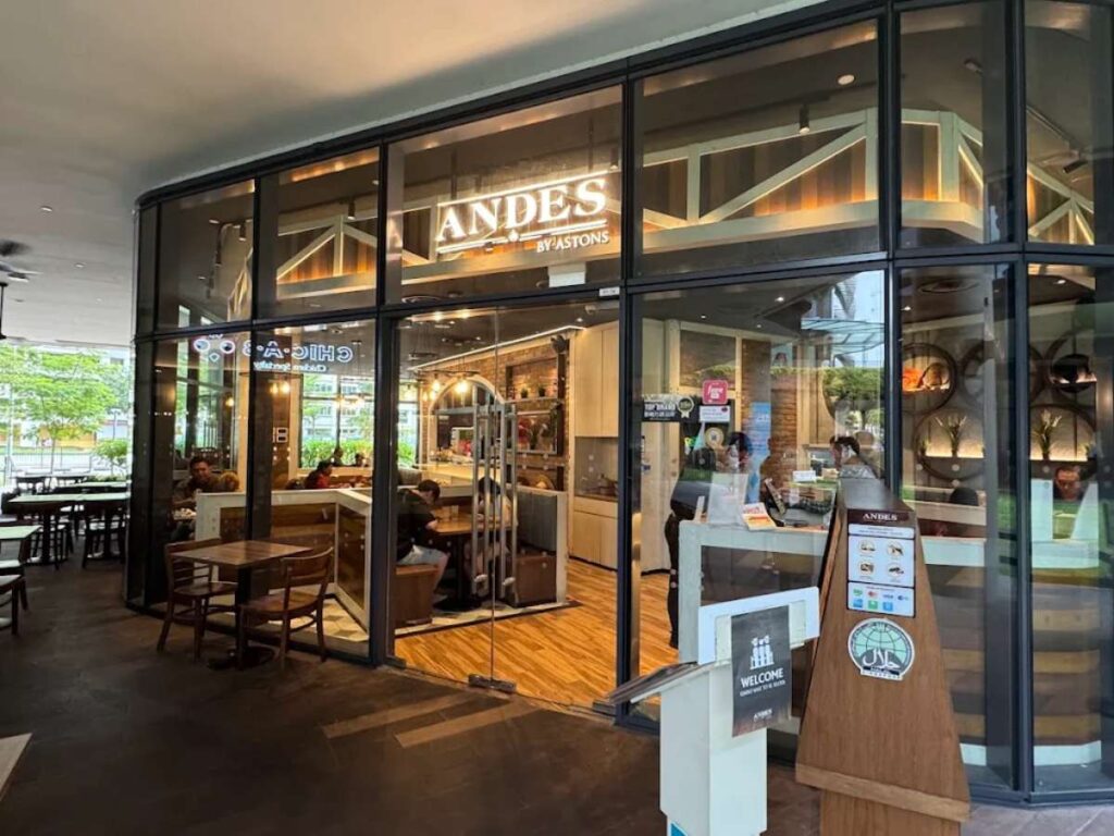 Woods Square Food Guide (2026): 20+ Best Restaurants & Halal Eats 3 Plate of grilled meats and sides from Andes by Astons at Woods Square.