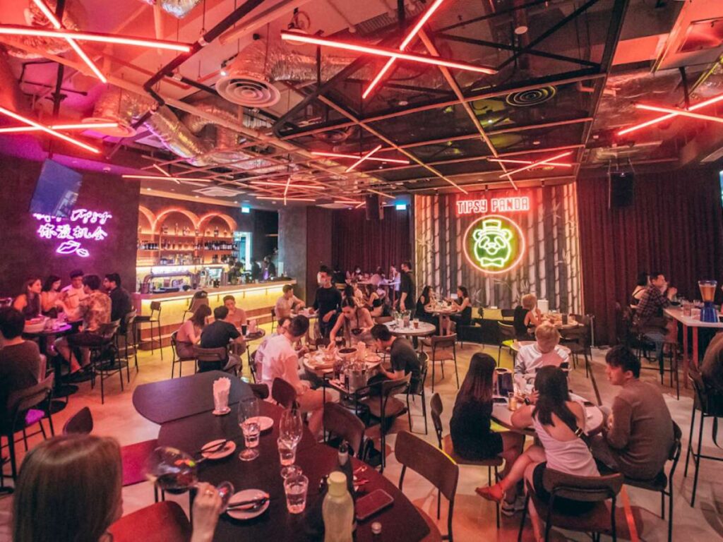 Woods Square Food Guide (2026): 20+ Best Restaurants & Halal Eats 12 Tipsy Panda – Casual, lively dining spot with noodles, cocktails, and small group-friendly meals.