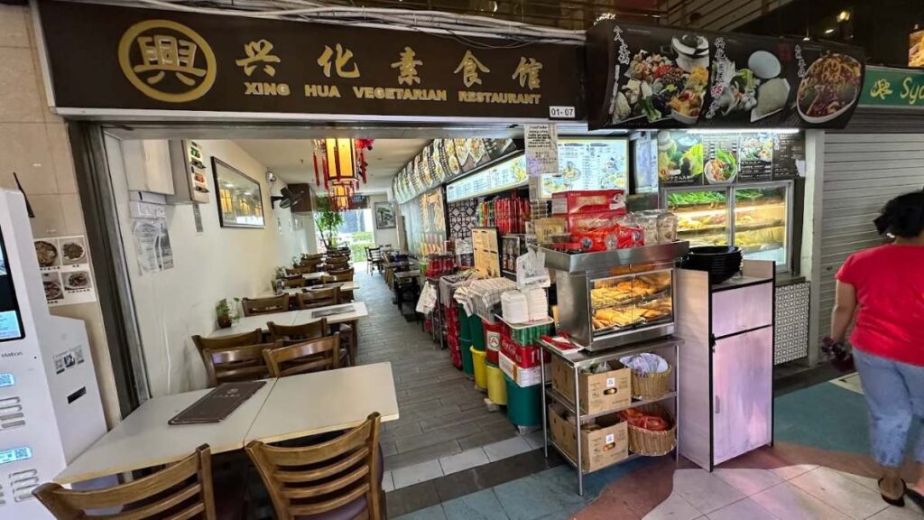 Fortune Centre Food Guide (2026): 35 Best Places to Eat 33 Vegetarian restaurant interior with food displays.