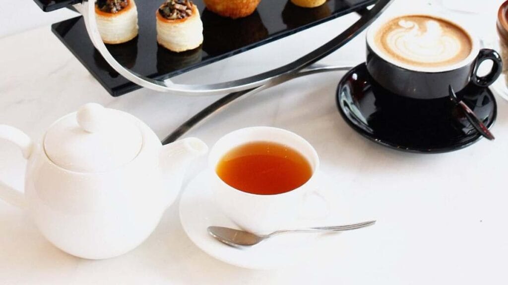 L’eclair by Sarah Michelle: Chic degustation high tea set with artisanal Ispahan eclairs and savory chicken pie for the best high tea Singapore.  