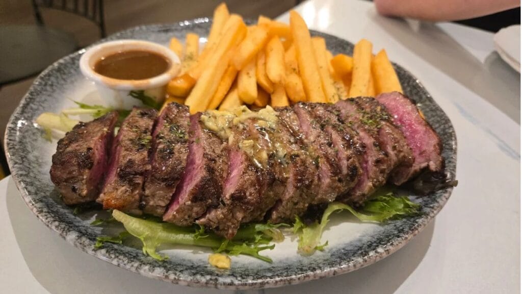 Premium tender Steak Frites and classic rich French Onion Soup for dinner at The Secret Garden By Zeekri.