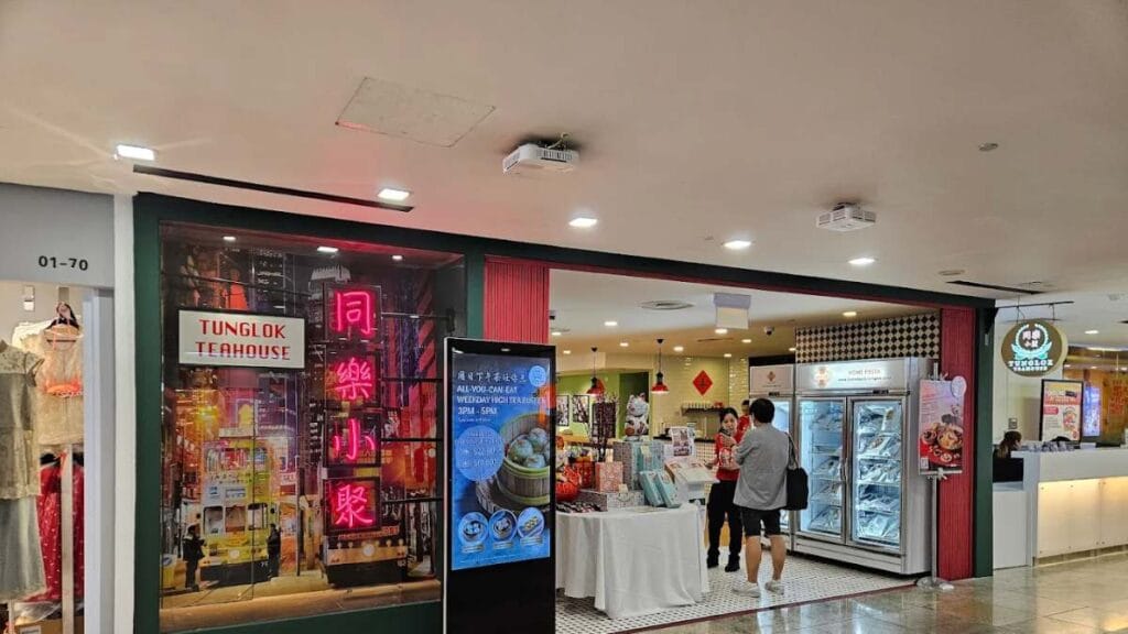 TungLok Teahouse (Square 2): Vintage 1960s teahouse interior with a dim sum buffet spread and signature crispy youtiao cheong fun for the best high tea Singapore.