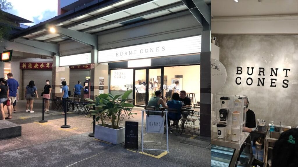 Best Dog Cafe Singapore: 26 Pet-Friendly Spots (2026) 24 A dog resting near the outdoor seating of Burnt Cones, a late-night gelato and dog cafe singapore in Clementi.