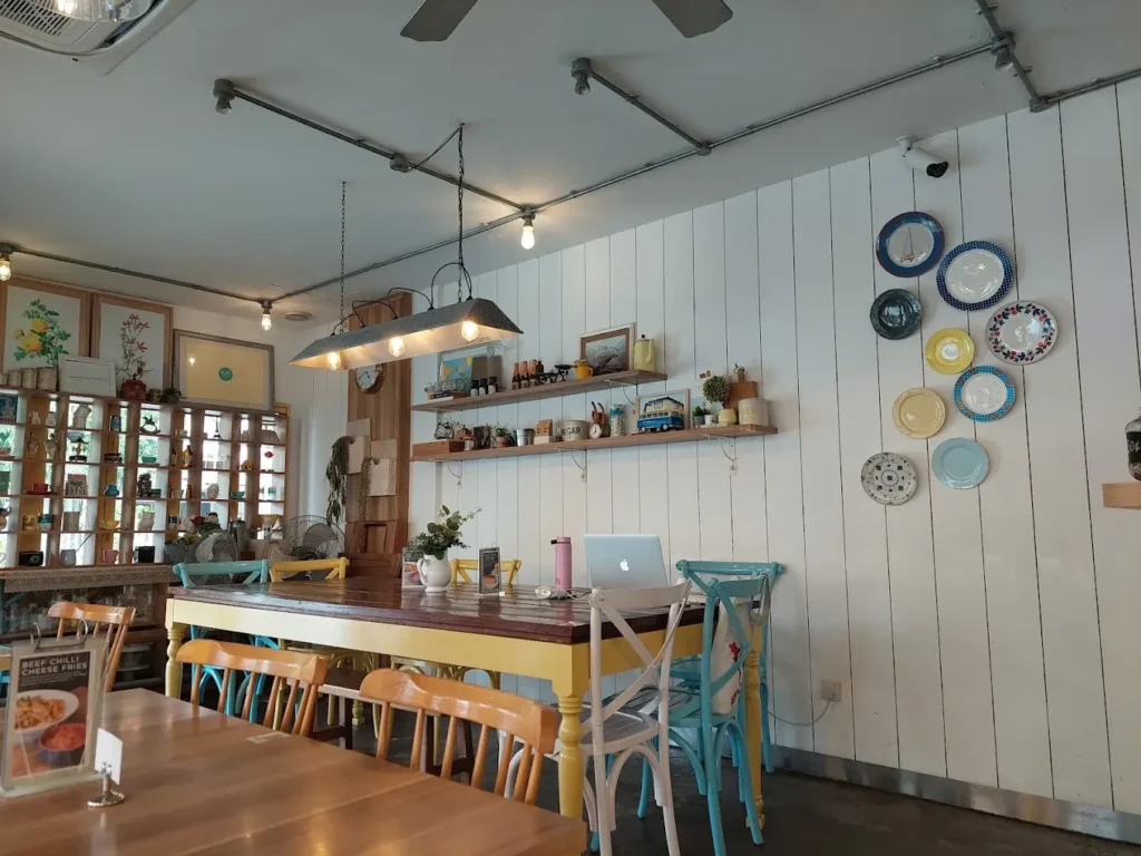 Best Dog Cafe Singapore: 26 Pet-Friendly Spots (2026) 17 A dog enjoying a pet biscuit treat at the outdoor seating of W39 Bistro & Bakery, a popular dog cafe in Clementi.